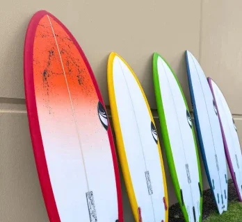 Colorful surfboards displayed in a row